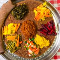 Veggie Combo · Spicy solit lintil 'misir' (red and yellow) alecha, yellow peas (kiki wot) collard greens (g...