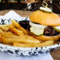 Brisket Sandwich · Topped with pickles and onions served on a butter toasted bun. Choose between Sliced or Chop...