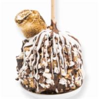 S'Mores · Caramel apple covered in milk chocolate rolled in graham cracker pieces, chocolate chips, mi...