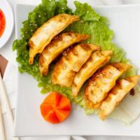 Golden Dumpling (6) · Chicken and vegetables. Butter/ Sauce and garlic / signature fish sauce.