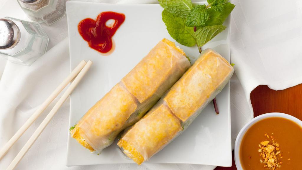 Vegetarian Spring Rolls (2 Rolls) · Tofu, vermicelli noodles, bean sprouts, mint, and lettuce rolled in a thin rice paper. Served with a savory peanut sauce dip.