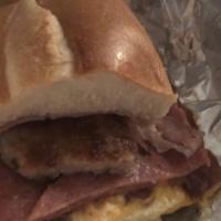 Johnny Belly Buster · Three eggs, ham, sausage, pork roll,  bacon and a hash brown stuffed into 8