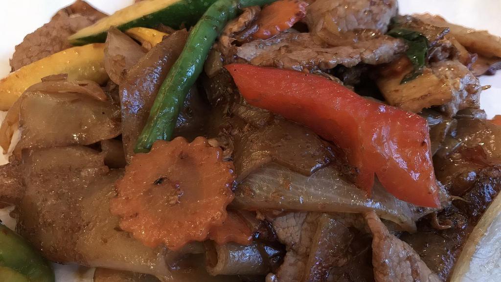 Drunken Noodles ** Burning Lips · Thick wide rice noodle, wok-stirred w/ beef, spicy thai basil chili base, veggies & egg.