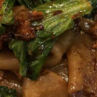 Pad See Ew · Sweet black soy infused think wide rice noodle, beef, egg, Chinese broccoli, & reg. broccoli.