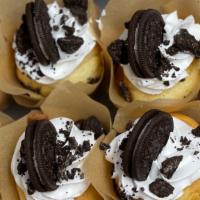 Oreo Cupcakes  · vanilla Cupcake filled  and topped with crushed Oreos