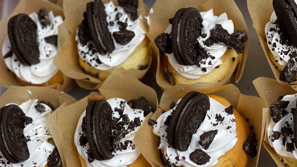 Oreo Cupcakes  · vanilla Cupcake filled  and topped with crushed Oreos