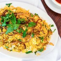 Chicken Biryani · Marinated chicken cooked with basmati rice and herbs, tossed with fried onions.