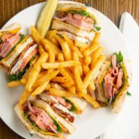 Triple Decker Club · House roasted turkey and ham with bacon, lettuce, tomato, mayo, and cheddar cheese on white ...