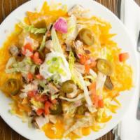 Nachos · Gluten free. Cheddar Jack melted over our own white corn tortilla chips with a side of fresh...