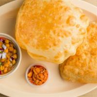 Chole Bathura (2) · White flour puffy bread, served with chickpea curry.