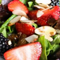 Mixed Berry Salad · Greens, Fresh Seasonal Berries, Sliced Almonds, and Crumbled Feta. Served with Balsamic Vina...