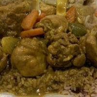 Curry Chicken · Curry chicken cooked with  assorted vegetables, comes with a choice of white rice or beans a...