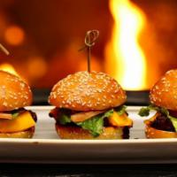 Cheeseburger Sliders · 3 classic mini burgers. Topped with American cheese, lettuce, tomato, and secret sauce