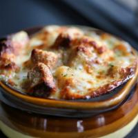 French Onion Soup · Caramelized onions, croutons, Swiss & provolone crust