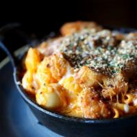 Buffalo Mac & Cheese · Crispy buffalo chicken baked in a four cheese blend topped with garlic breadcrumbs