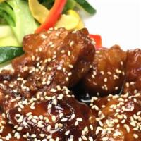Sesame Chicken · Fried lightly breaded chicken breast with sesame sauce and sesame seeds.