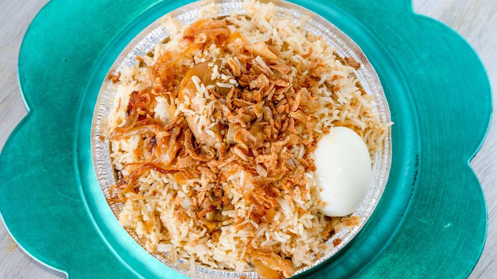 Chicken Dum Biryani · Basmati rice and tender pieces of richly saffron flavored chicken cooked with exotic Indian herbs.