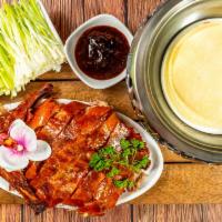 Peking Duck · Whole Duck and includes 12pc Pancakes, Scallions,  Cucumber Slices, and Hoisin Sauce.