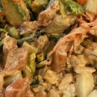 Salmon Poke Bowl · Rice, salmon, lettuce, cucumber, avocado, edamame, seaweed salad, carrot, masago, shredded s...