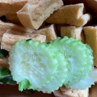 Fried Tofu · Fried tofu serve with sweet chili sauce, peanuts, cilantro, and a side of cucumbers.