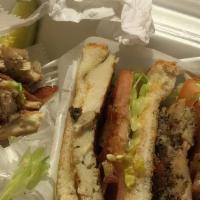 Club Sandwich · Triple decker with ham, turkey, bacon, lettuce, tomatoes and mayo.
