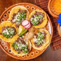 Street Tacos · 5 Mini Corn tortillas Filled with your choice of meat, topped with cilantro, onion and queso...