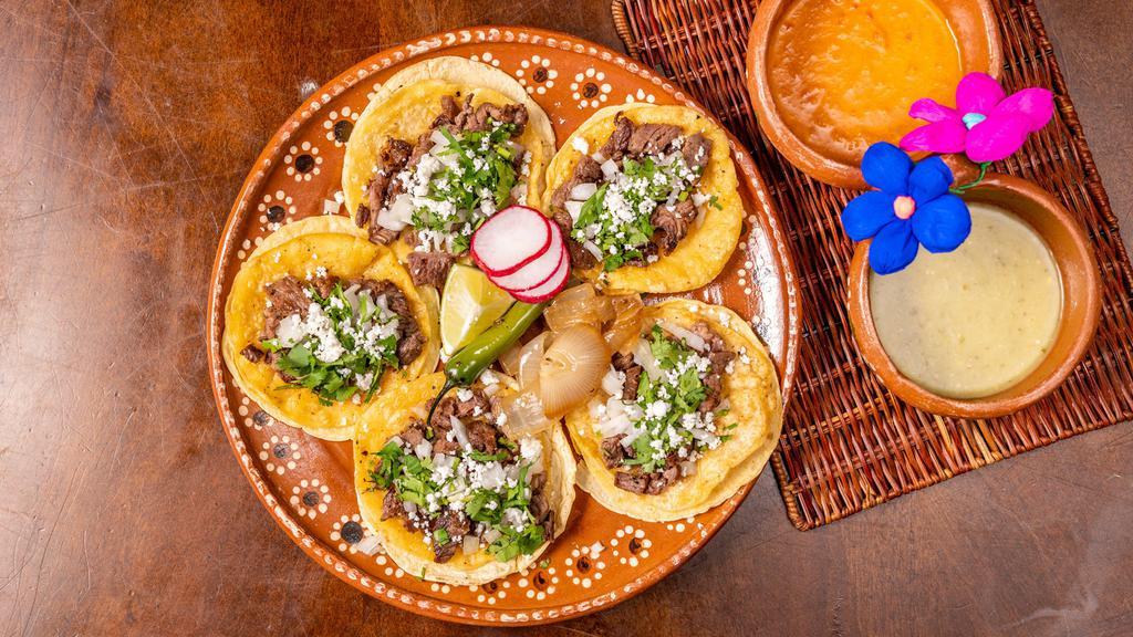 Street Tacos · 5 Mini Corn tortillas Filled with your choice of meat, topped with cilantro, onion and queso fresco.