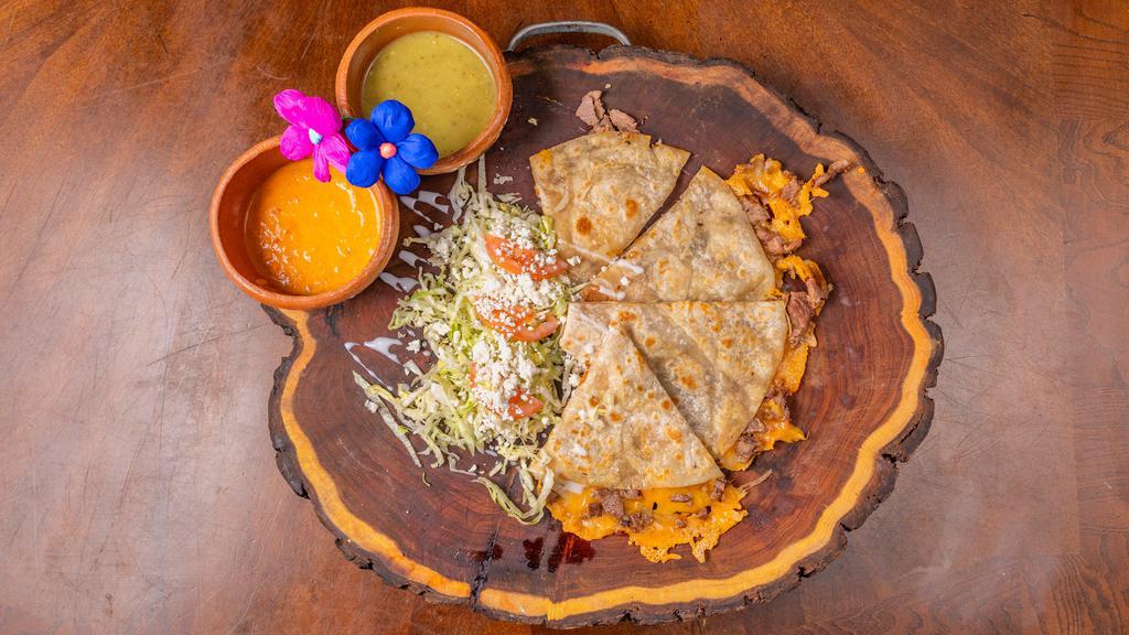 Quesadilla · 12” Flour tortilla filled with your choice of meat, cheese included, cooked until crispy and wonderfully melted served with a side of lettuce, tomato, crema mexicana.