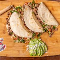 Harina Tacos (Flour Tortilla Tacos) · 3 Flour tacos with your choice of meat, with  pico de gallo and avocado sauce.