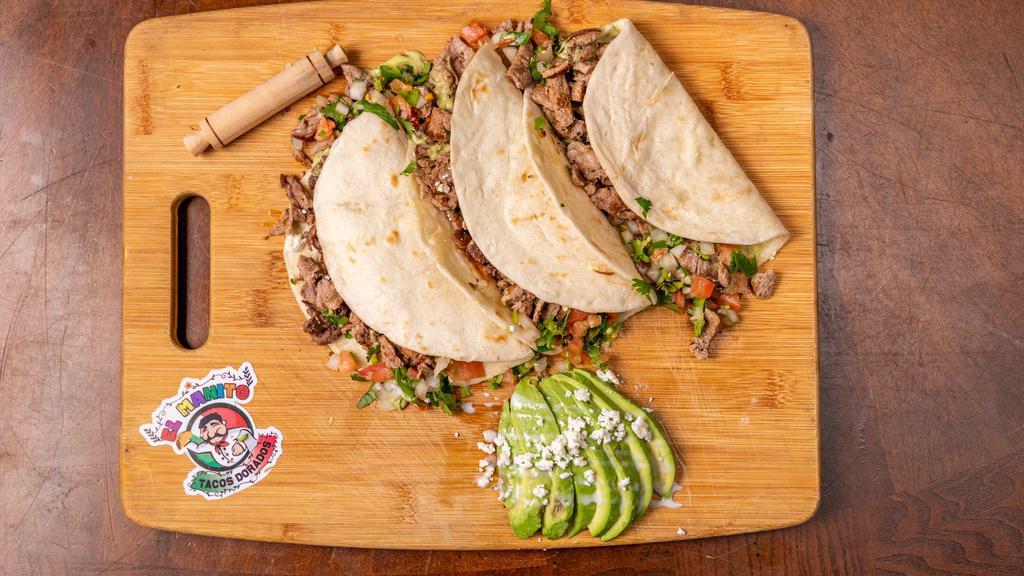 Harina Tacos (Flour Tortilla Tacos) · 3 Flour tacos with your choice of meat, with  pico de gallo and avocado sauce.