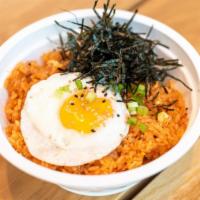 Kimchi Fried Rice · Flavourful stir-fried rice with kimchi and vegetables, topped with a sunny-side-up egg.