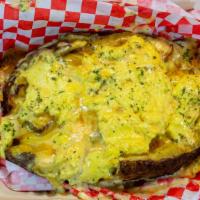 Dirty Side · Andouille sausage, bacon, scrambled eggs, cheese, and cajun cream sauce loaded onto a baked ...