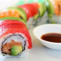 Rainbow Roll · Crab, cucumber, avocado inside with tuna, salmon, sea bass and yellowtail draped on the outs...