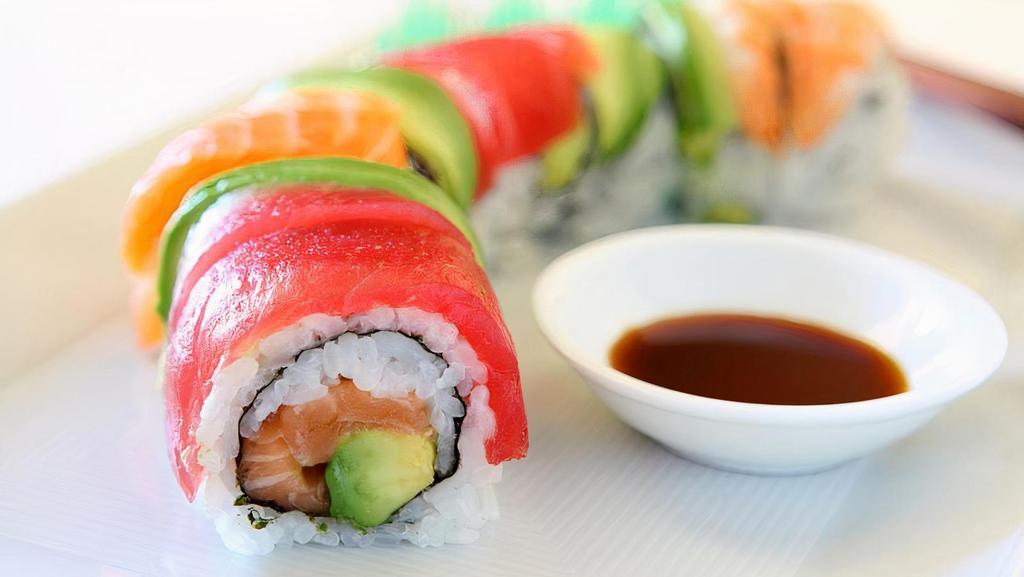 Rainbow Roll · Crab, cucumber, avocado inside with tuna, salmon, sea bass and yellowtail draped on the outside, topped with tobiko.
