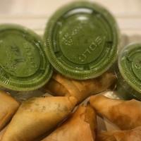 Samosas (Order Of 6) · Fried pastry filled with potatoes, green peas and spices. Served with home made chutney sauce