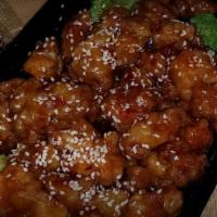 Sesame Chicken · Deep-fried, crispy boneless chicken in our house special sweet & hot spicy sauce with sesame...
