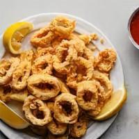 Calamari · Vegetarian. Golden brown fried calamari served with our home-made marinara or tartar sauce.