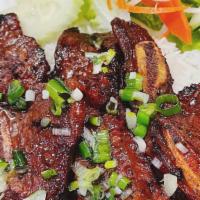 Beef Short Ribs / Cơm Sườn Bò Nướng · Steamed rice with grilled beef short ribs, lettuce, cucumber served with sweetened fish sauc...