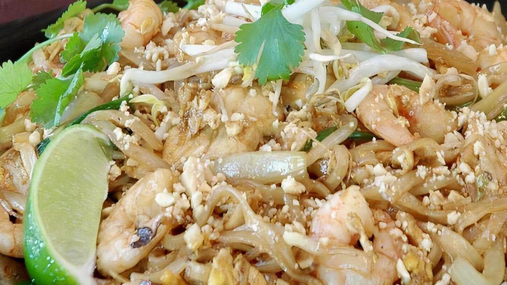 Pad Thai · Thin rice stick noodles, egg, green onions, yellow onions, bean sprouts, crushed peanuts, cilantro and lime.
