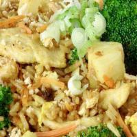 Pineapple Fried Rice ♨️(V) · Egg, pineapple, broccoli, carrots, raisins, green onions, crushed peanuts in yellow curry. V...