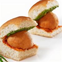 Vada Pao · Deep fried potato patty with spices, served in a bread bun (pao) with condiments.