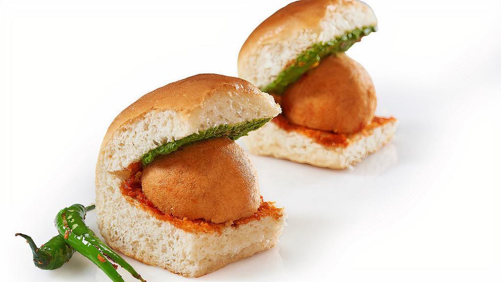 Vada Pao · Deep fried potato patty with spices, served in a bread bun (pao) with condiments.