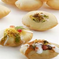 Dahi Puri · Crispy sphere-shaped balls stuffed with diced boiled potatoes and sprouted black gram, garni...