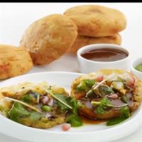 Aloo Tikki · Crisp and browned spiced potato patties served with spicy North Indian chickpea.