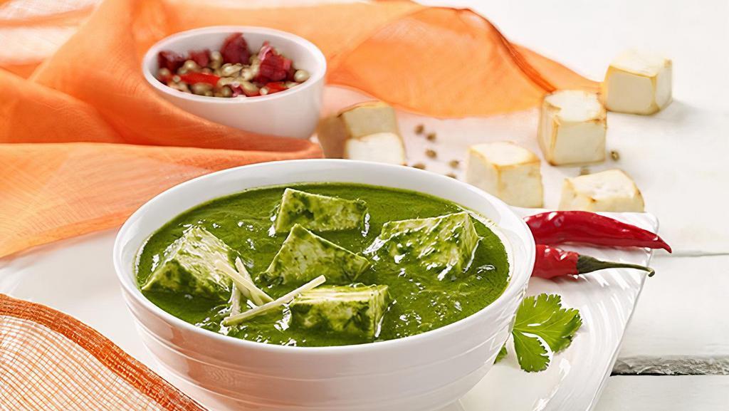 Palak Paneer · Cottage cheese cooked in a thick paste of spinach and seasoned with garam masala, and other spices. Come with Rice