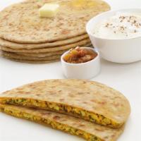 Stuffed Paratha · Served with raita shallow fry whole wheat bread stuffed with a mixture of Paneer (Cottage ch...