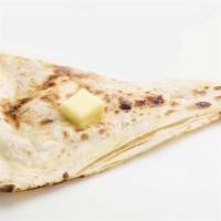 Butter Naan · Traditional Indian refined flour bread cooked in oven (tandoor) and layered with butter.