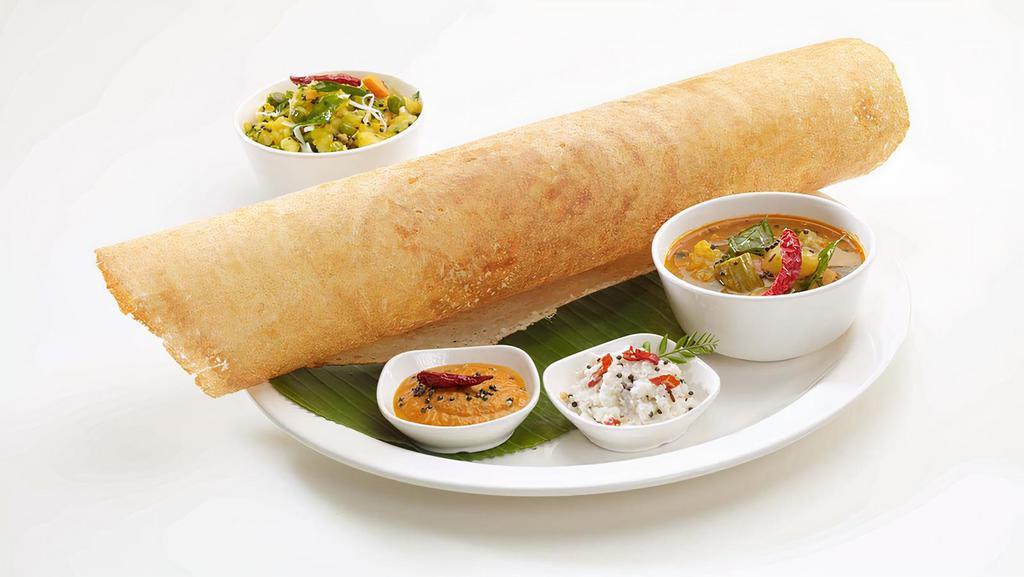 Masala Dosa · Thin pancake made from a fermented batter. It is similar to a crepe made of rice and black gram lentils and served with potato mixture with condiments.