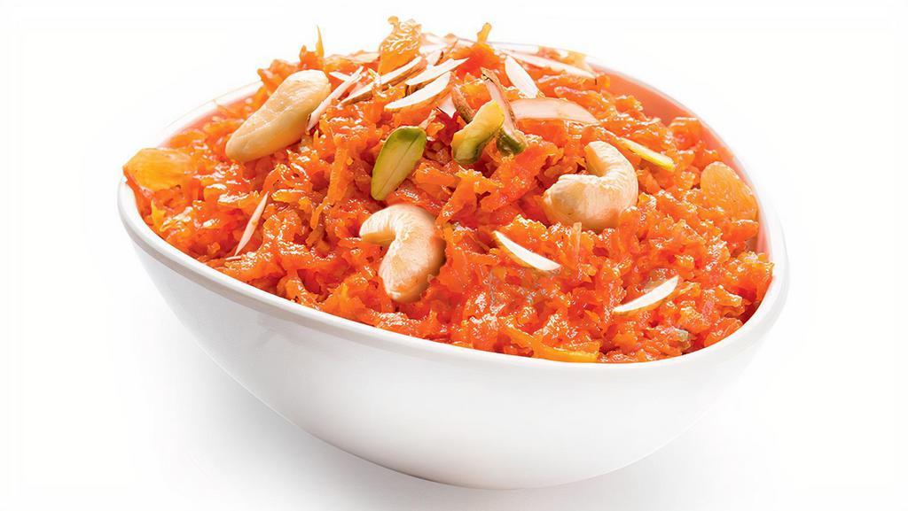 Gajar Halwa · Mouthwatering Indian dessert made of grated carrots cooked gently in milk and sprinkled generously with nuts.