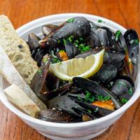 Steamed Mussels With Garlic · 1 lb.  Stream mussels cook with garlic, butter, and white wine sauce. Serve with two slices ...